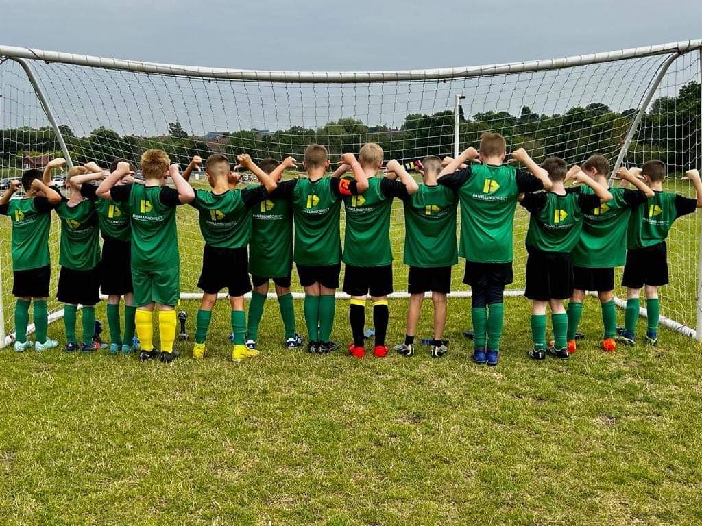 Sponsored football team showing Panelling Direct shirts